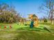 Backyard playground with a slide, swings, and picnic table for Gathering fun at 15101 Rawls Rd, Sarasota, FL 34240