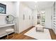 Spacious walk-in closet with custom shelving, mirrored doors, and a stylish vanity area at 15101 Rawls Rd, Sarasota, FL 34240