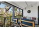 This comfortable balcony features cozy seating and peaceful water views for relaxing and enjoying the scenery at 1519 Pelican Point Dr # 288, Sarasota, FL 34231