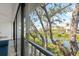 This balcony offers a serene water view, complemented by lush trees and a peaceful setting for relaxation at 1519 Pelican Point Dr # 288, Sarasota, FL 34231