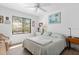 Bright bedroom featuring a large window, comfortable bedding, and a peaceful atmosphere for a good night's sleep at 1519 Pelican Point Dr # 288, Sarasota, FL 34231