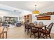 Open concept dining room and living room with hardwood floors, lots of light, and a sleek, modern design at 1519 Pelican Point Dr # 288, Sarasota, FL 34231