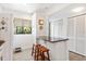 Kitchen featuring white cabinetry, granite counters, a breakfast bar with seating, and a bright, open design at 1519 Pelican Point Dr # 288, Sarasota, FL 34231