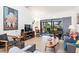 Cozy living room featuring comfortable seating, a television, and sliding glass doors that lead to a screened-in porch at 1519 Pelican Point Dr # 288, Sarasota, FL 34231