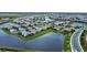 Aerial view of the community featuring single-Gathering homes, water features, and well-maintained landscaping at 16111 Sunny Day Dr, Bradenton, FL 34211