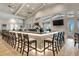 Stylish bar area with seating and TV, perfect for entertaining and relaxation at 16111 Sunny Day Dr, Bradenton, FL 34211