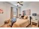Bright bedroom with neutral bedding, throw pillows, and an abstract painting above the bed at 16111 Sunny Day Dr, Bradenton, FL 34211