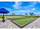 Bocce ball court and volleyball court with a covered bench. Perfect for community recreation at 16111 Sunny Day Dr, Bradenton, FL 34211
