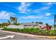Welcoming community entrance sign surrounded by vibrant landscaping at Lorraine Lakes at Lakewood Ranch at 16111 Sunny Day Dr, Bradenton, FL 34211