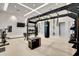 Modern gym equipped with punching bag, plyo box, and TRX system for versatile workouts at 16111 Sunny Day Dr, Bradenton, FL 34211