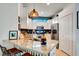 Modern kitchen featuring granite countertops, stainless steel appliances, and stylish barstool seating at 16111 Sunny Day Dr, Bradenton, FL 34211