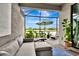 Covered patio featuring cozy sectional seating, stylish rug, and screened enclosure for ultimate relaxation at 16111 Sunny Day Dr, Bradenton, FL 34211