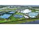 Aerial view of recreational area with tennis, basketball, and splash park for community residents at 16111 Sunny Day Dr, Bradenton, FL 34211