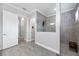 Spacious bathroom featuring tiled walk-in shower with frameless glass and neutral color scheme at 17519 Polo Trl, Lakewood Ranch, FL 34211