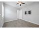 Bright bedroom features wood-look tile flooring and recessed lighting at 17519 Polo Trl, Lakewood Ranch, FL 34211