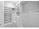 Walk-in closet with custom shelving and drawers for optimal organization at 17519 Polo Trl, Lakewood Ranch, FL 34211