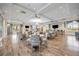 Spacious clubhouse with seating, tables, TVs, and ceiling fans, ideal for community gatherings at 17519 Polo Trl, Lakewood Ranch, FL 34211
