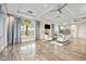 Inviting clubhouse features a cozy seating area, fireplace, TV, and bookshelves for relaxation at 17519 Polo Trl, Lakewood Ranch, FL 34211