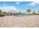 Upscale community pool area with lounge chairs and well-maintained brick patio, perfect for relaxation at 17519 Polo Trl, Lakewood Ranch, FL 34211
