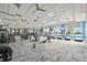 Bright community gym boasts state-of-the-art equipment, scenic windows, and multiple ceiling fans at 17519 Polo Trl, Lakewood Ranch, FL 34211
