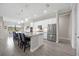 Bright kitchen with an island, six chairs, and stainless steel refrigerator at 17519 Polo Trl, Lakewood Ranch, FL 34211