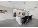 Contemporary kitchen with white cabinetry, stainless steel appliances, and a granite-topped island with seating at 17519 Polo Trl, Lakewood Ranch, FL 34211