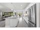 Bright, spacious kitchen with stainless steel appliances, granite countertops, and seamless access to the dining and living spaces at 17519 Polo Trl, Lakewood Ranch, FL 34211