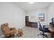 Home office featuring comfortable leather chair, wood furnishings, and natural light at 17519 Polo Trl, Lakewood Ranch, FL 34211