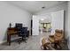 Inviting home office with a view into the living area, offering a cozy workspace at 17519 Polo Trl, Lakewood Ranch, FL 34211