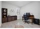 Functional home office with sleek furnishings, wood desk, and neutral color palette at 17519 Polo Trl, Lakewood Ranch, FL 34211