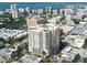 An aerial view of a high-rise building with a rooftop pool in a coastal city at 1771 Ringling Blvd # 902, Sarasota, FL 34236