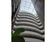 The interior atrium of a building features multiple floors, a skylight, and architectural design at 1771 Ringling Blvd # 902, Sarasota, FL 34236