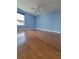 Inviting bedroom featuring beautiful wood floors, a ceiling fan, and a bright, airy atmosphere at 1771 Ringling Blvd # 902, Sarasota, FL 34236