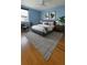 Stylish blue bedroom with a comfortable bed, plush rug, and artwork for a relaxing atmosphere at 1771 Ringling Blvd # 902, Sarasota, FL 34236