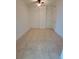 Bedroom featuring neutral tile flooring, ceiling fan and a door at 1771 Ringling Blvd # 902, Sarasota, FL 34236