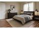 Cozy bedroom featuring neutral tones, soft rug, and a light-filled window at 1771 Ringling Blvd # 902, Sarasota, FL 34236