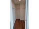 Walk-in closet offers ample storage with shelving and wooden floors, ready for organization at 1771 Ringling Blvd # 902, Sarasota, FL 34236