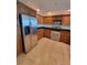 Kitchen featuring stainless steel appliances, granite countertops and wooden cabinetry at 1771 Ringling Blvd # 902, Sarasota, FL 34236