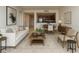 Inviting open-concept living space with modern furnishings and ample seating, flowing into the dining area and kitchen at 1771 Ringling Blvd # 902, Sarasota, FL 34236