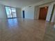 This tiled floor living room opens to the balcony and other rooms at 1771 Ringling Blvd # 902, Sarasota, FL 34236