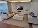 Comfortable lounge area with sofas, TV, console, and modern furnishings for relaxing and entertainment at 1771 Ringling Blvd # 902, Sarasota, FL 34236
