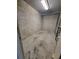 Unfinished storage room with concrete block walls, a concrete floor and a chainlink fence in a condo building at 1771 Ringling Blvd # 902, Sarasota, FL 34236