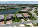 Aerial view showcasing the home's location on a waterfront lot within a picturesque community at 18010 Harwich Pl, Lakewood Ranch, FL 34202