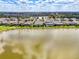 Aerial view of a neighborhood with a lake nearby at 18032 Polo Trl, Bradenton, FL 34211