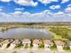 An aerial view showcasing the lakefront houses and community at 18032 Polo Trl, Bradenton, FL 34211