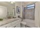 This is a stylish bathroom with a granite vanity, tiled shower and modern fixtures at 18032 Polo Trl, Bradenton, FL 34211