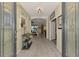 Inviting foyer with decorative mirror and gray tile flooring at 18032 Polo Trl, Bradenton, FL 34211