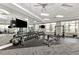 Community gym equipped with weight racks, flat screen tvs, a rubber floor section, and mirrored wall at 18032 Polo Trl, Bradenton, FL 34211