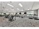 Community gym featuring modern exercise equipment, treadmills, and floor to ceiling windows showcasing pool views at 18032 Polo Trl, Bradenton, FL 34211