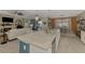 Kitchen featuring a large island with granite countertops and stainless steel appliances in an open-concept space at 18032 Polo Trl, Bradenton, FL 34211